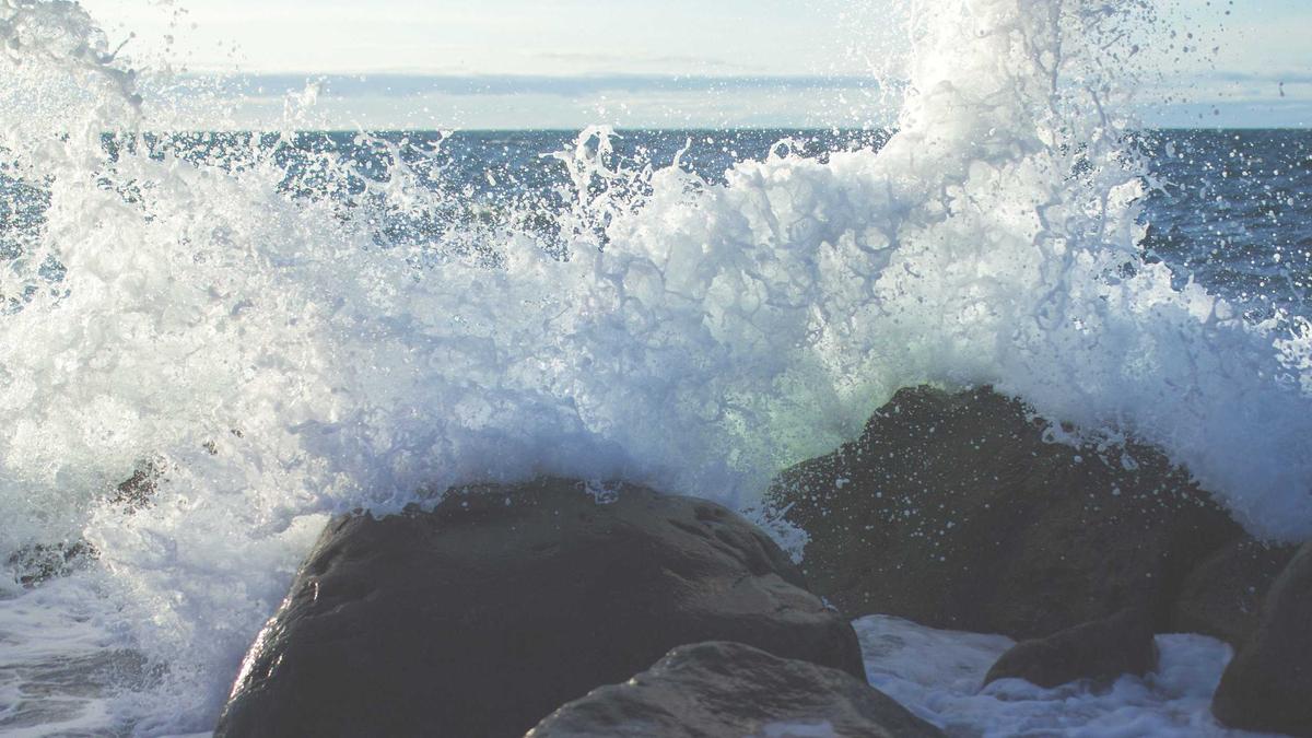 YouTube homepage on laptop showing algorithm-recommended videos and subscriber feed with high engagement content